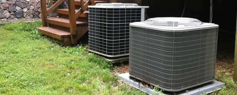 Heat pump installation and service units outside a home in Des Moines, IA
